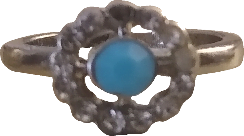 a ring with a blue center gem with a silver crosshair rim